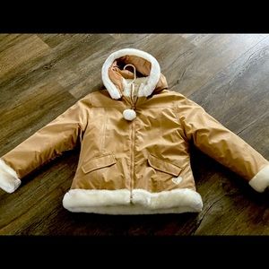 Tan coat with soft fluff interior. Reversible NEW